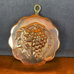 Vintage brass grape stamped wall hanging